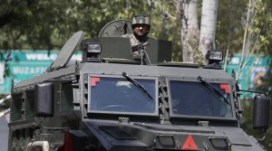 Uri: An army soldier guards the army base which was attacked by suspected rebels in Uri, in Jammu and Kashmir on Sunday. PTI Photo (PTI9_18_2016_000202B)